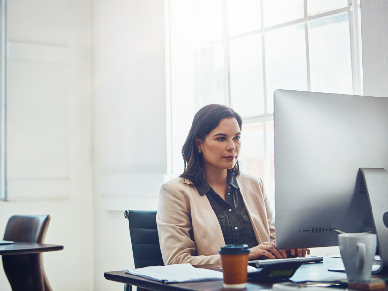 Shot of a young businesswoman working on a computer in an office